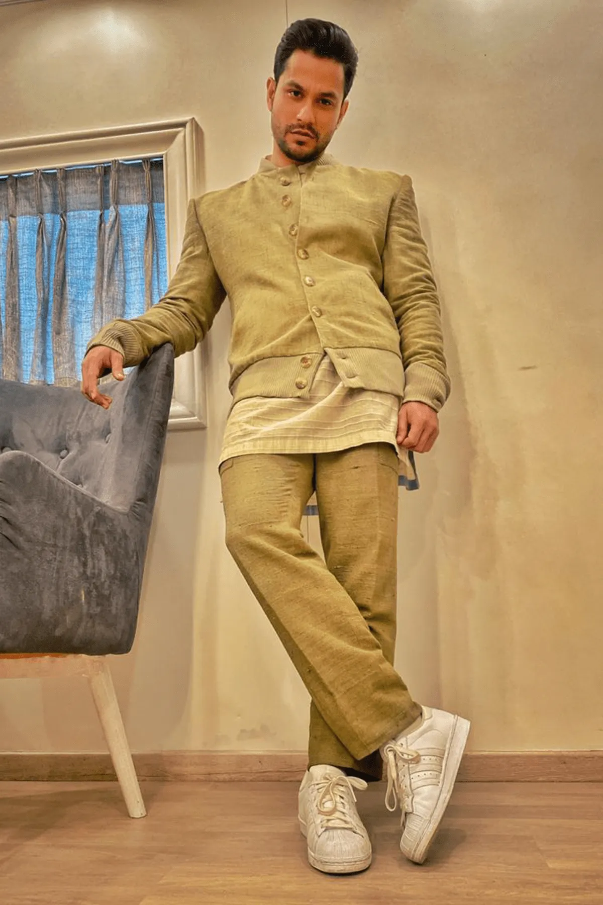 Kunal Khemu In Olive green bomber jacket with off white kurta and olive green trousers