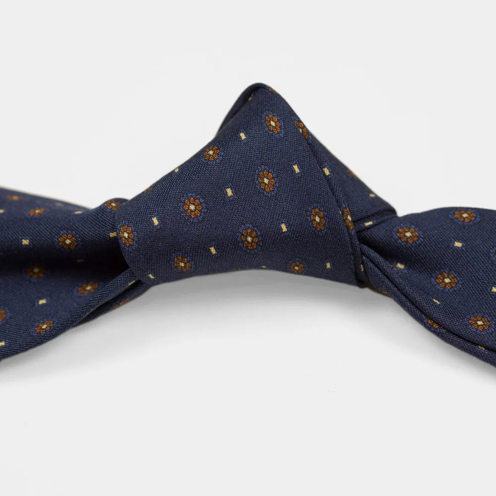 Navy silk twill tie, copper & blue rosette neat print