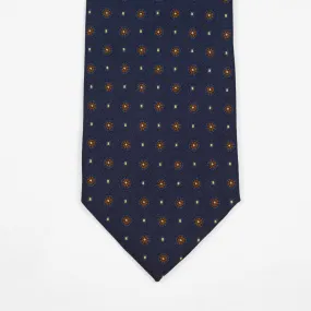 Navy silk twill tie, copper & blue rosette neat print