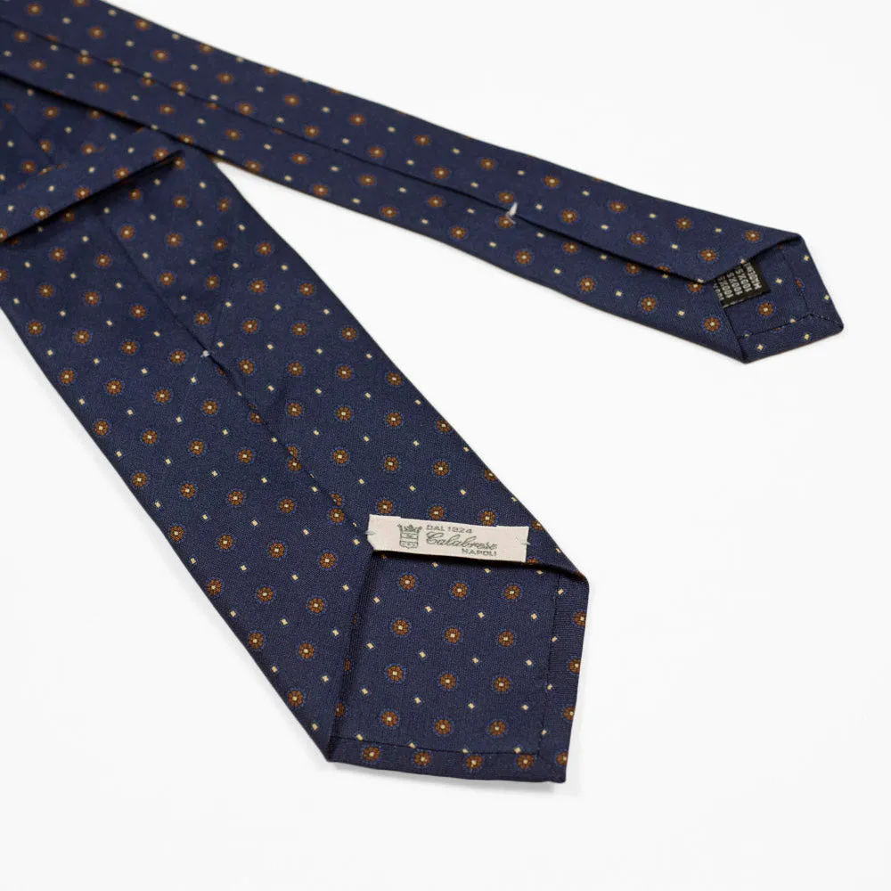 Navy silk twill tie, copper & blue rosette neat print