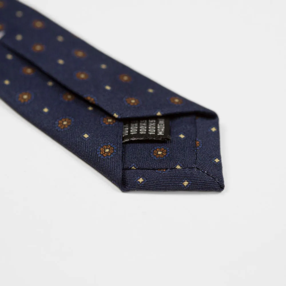 Navy silk twill tie, copper & blue rosette neat print