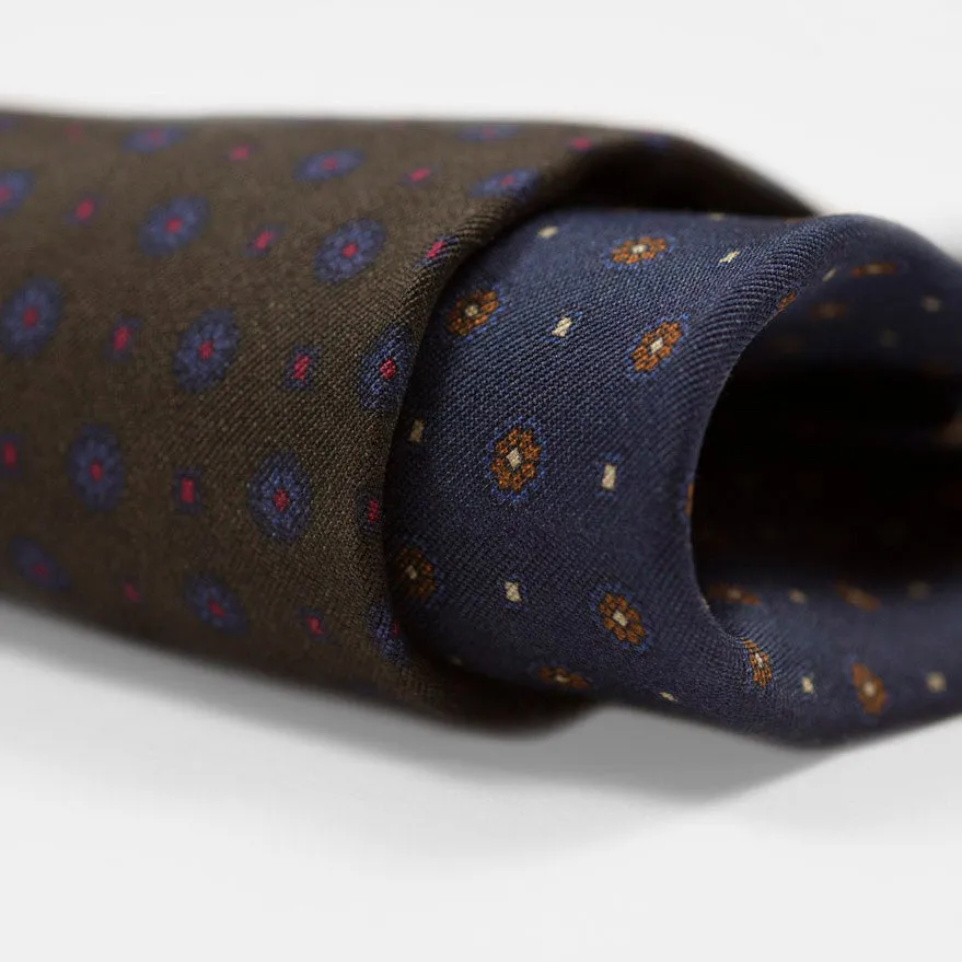 Navy silk twill tie, copper & blue rosette neat print