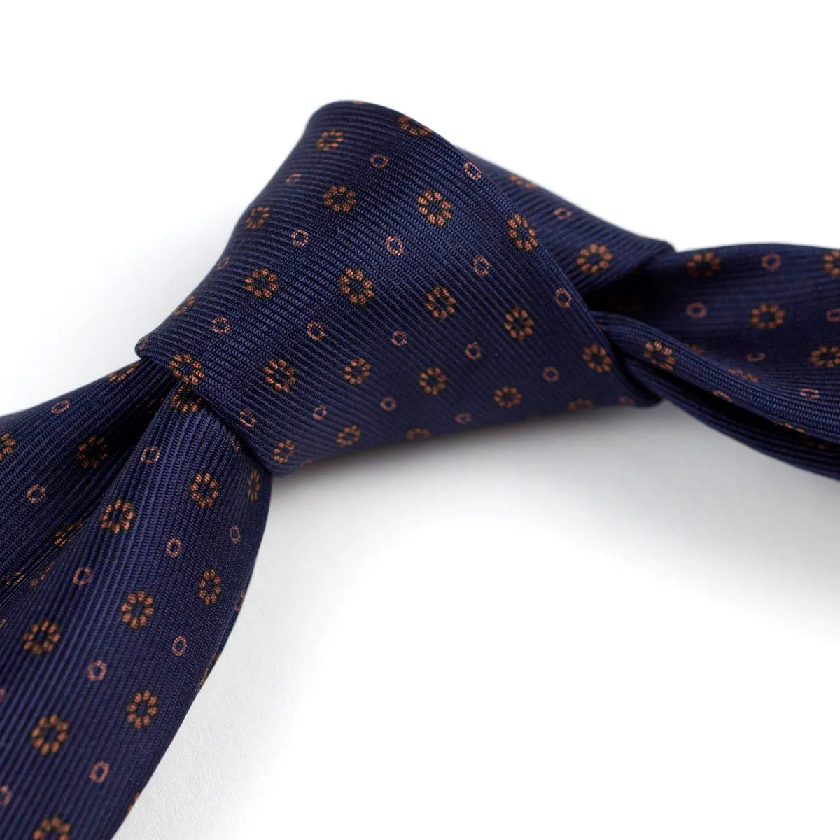 Self-tipped navy repp silk tie, copper neat prints