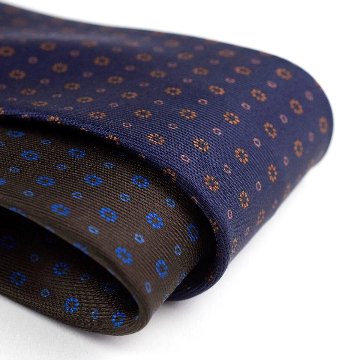 Self-tipped navy repp silk tie, copper neat prints
