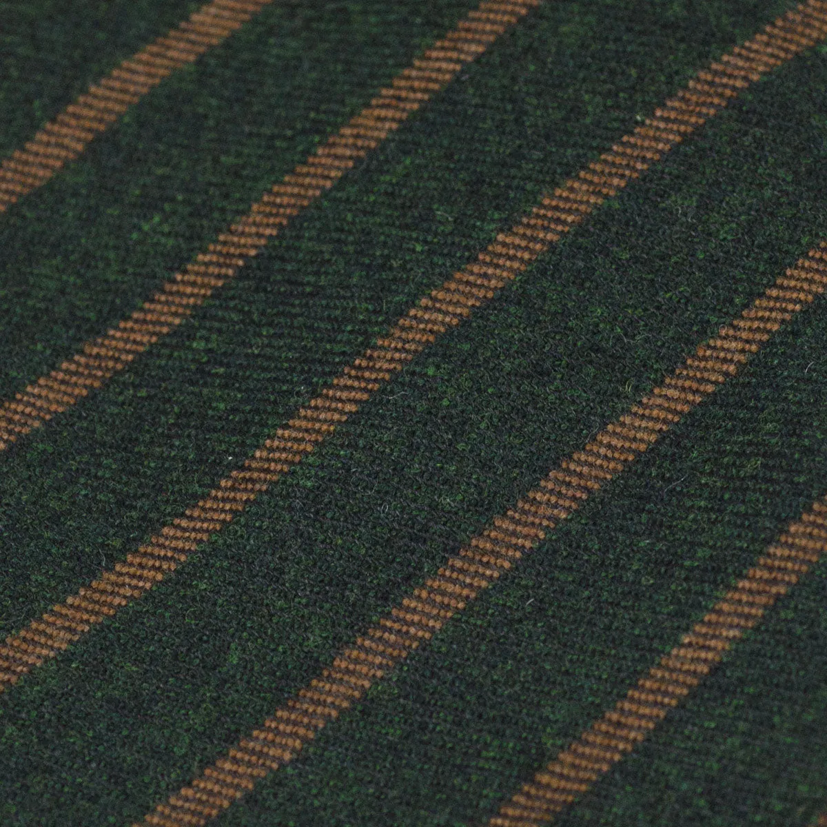 Untipped and handrolled dark green cashmere and silk tie, copper stripes